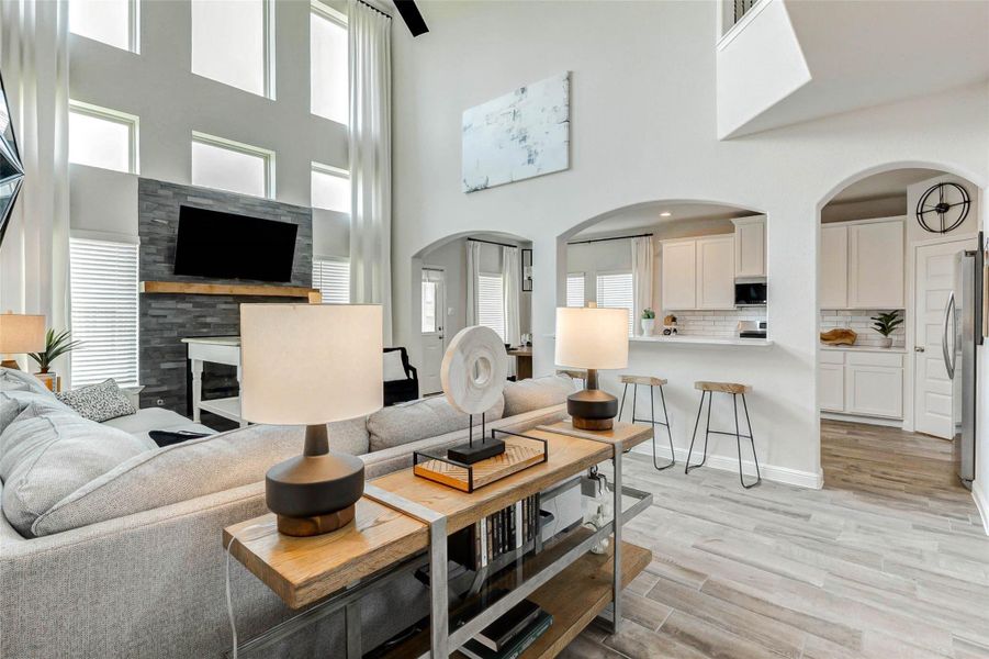 An open-concept layout connects the family room to the gourmet kitchen for effortless entertaining. An open-concept layout connects the family room to the gourmet kitchen for effortless entertaining.