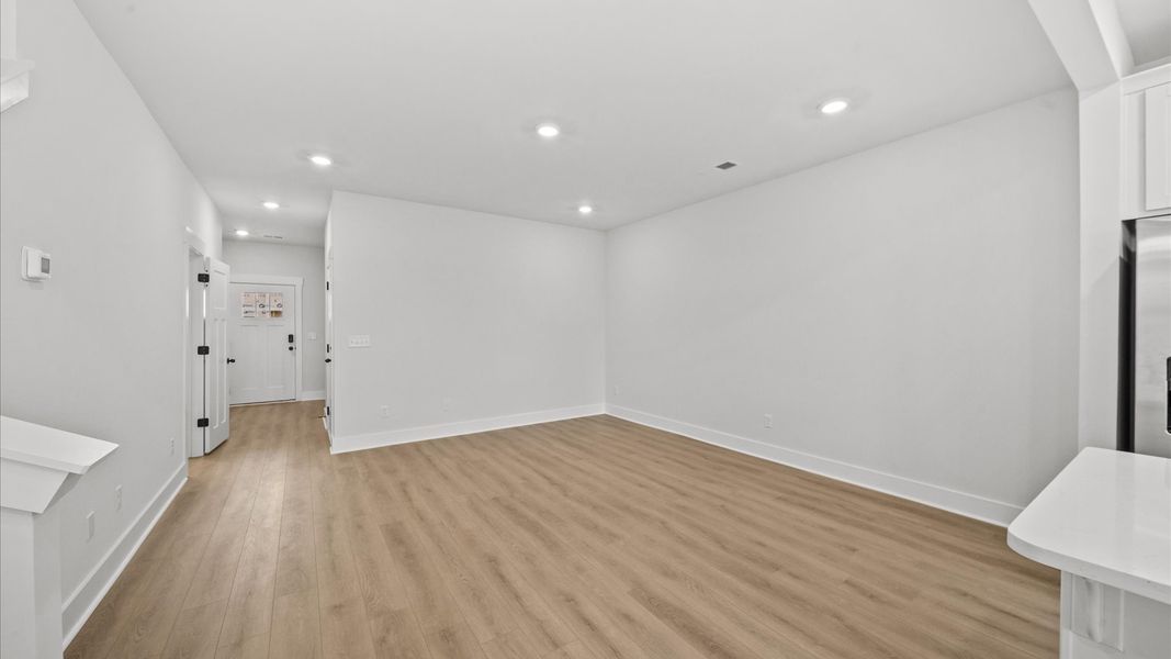 Vibrant two-story townhome featuring a modern family room with exceptional finishes