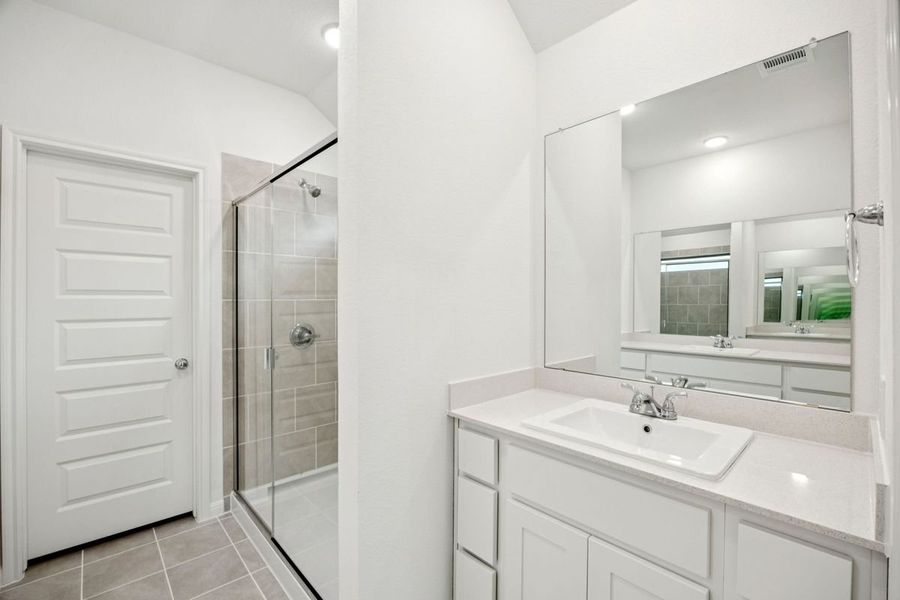 Primary Bathroom in the Spruce home plan by Trophy Signature Homes - REPRESENTATIVE PHOTO
