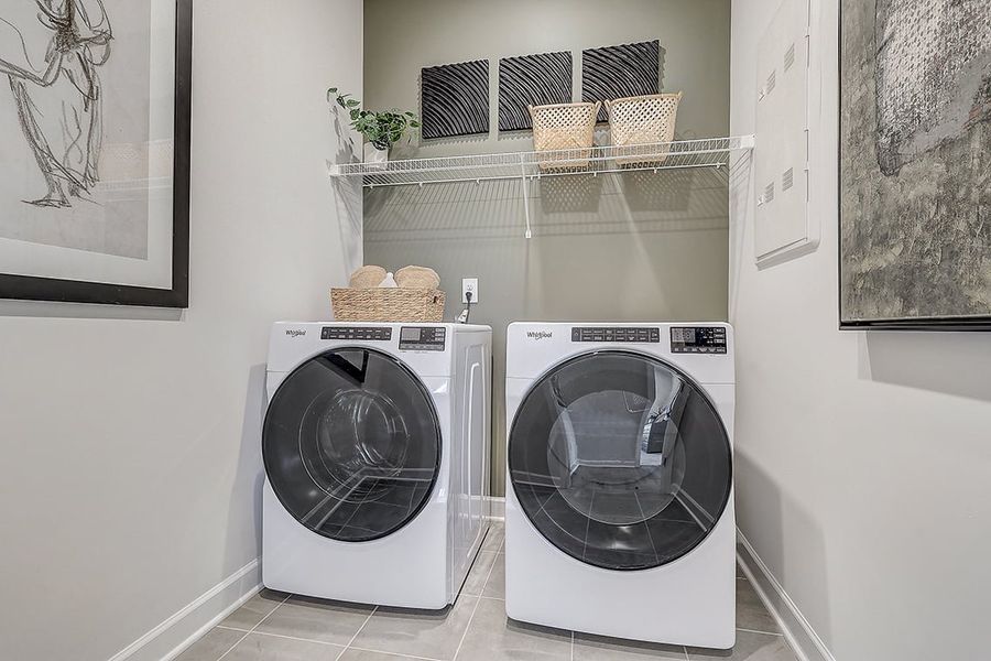 A washing machine in a room.