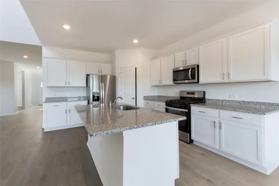 Furnished interior view inside a new home in Bar W Ranch, Leander (Image 5). Furnished interior view inside a new home in Bar W Ranch, Leander (Image 5).