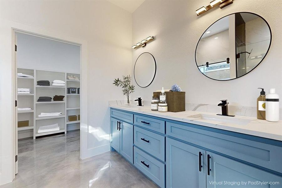 Bathroom with concrete flooring and dual bowl vanity