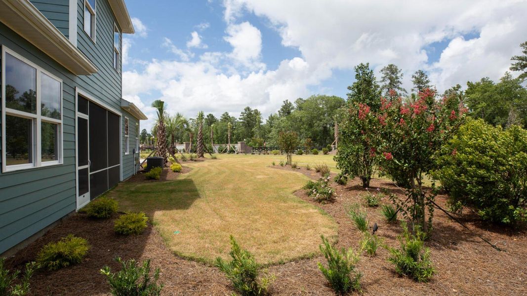 Exterior details and patio area of a home in Indigo Preserve, Leland (Image 25).