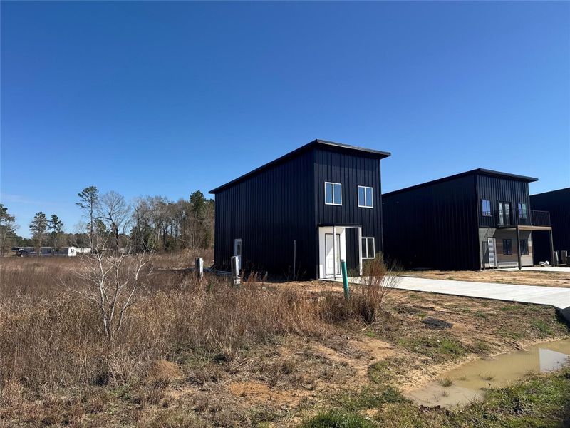 Front exterior of a new home in , Cleveland, TX, highlighting curb appeal (Image 11).