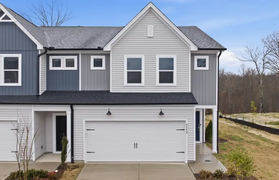 Front exterior of a new home in McConnell Ridge, McLeansville, NC, highlighting curb appeal (Image 2). Front exterior of a new home in McConnell Ridge, McLeansville, NC, highlighting curb appeal (Image 2).