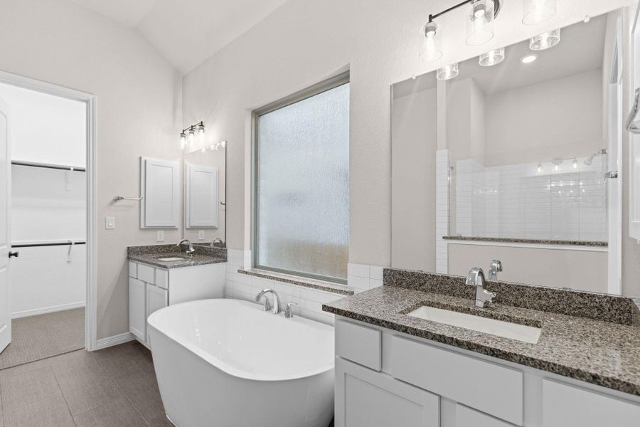 Primary Bath retreat with dual vanities & soaking tub