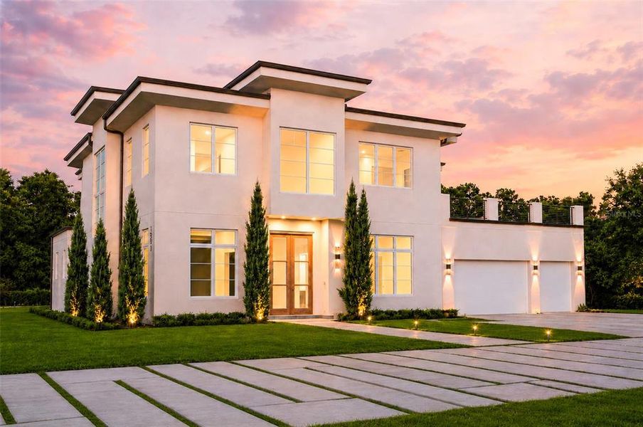 Front exterior of a new home in , Lake Mary, FL, highlighting curb appeal (Image 2). Front exterior of a new home in , Lake Mary, FL, highlighting curb appeal (Image 2).
