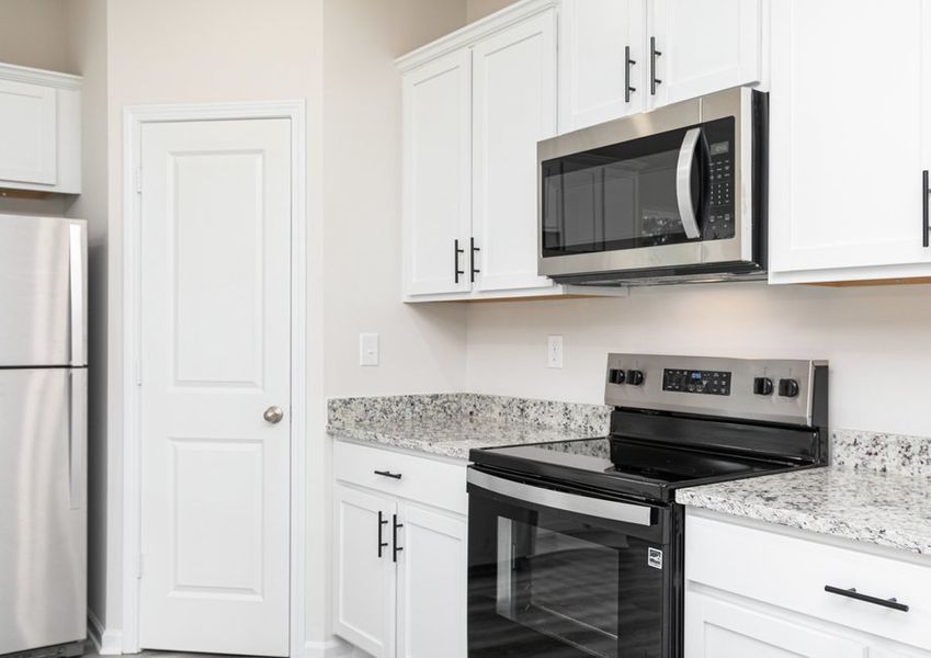 Each kitchen includes stainless-steel appliances
