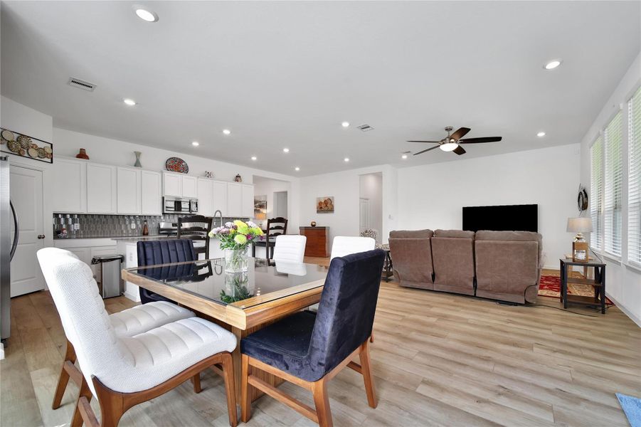 The oversized island is large enough for dining but you also have this dining nook just off the back door