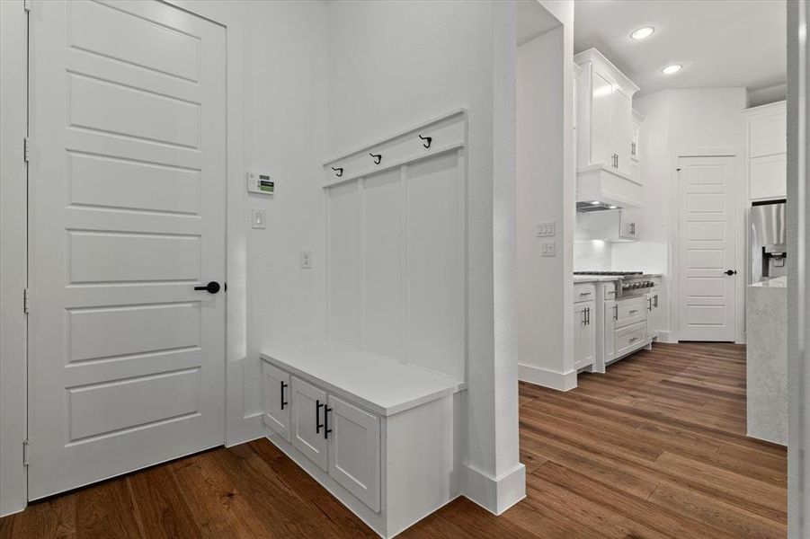 Mudroom featuring dark wood-type flooring and recessed lighting Mudroom featuring dark wood-type flooring and recessed lighting