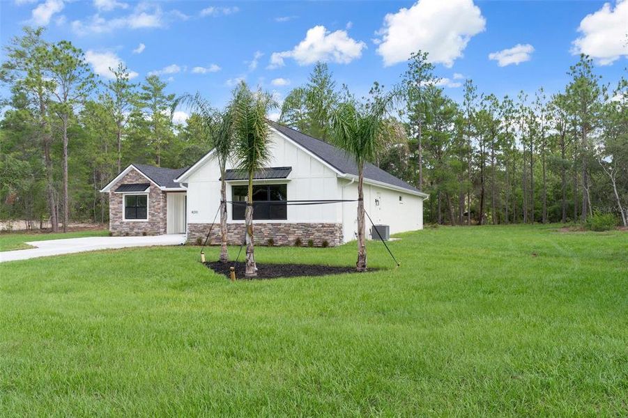Front exterior of a new home in , Beverly Hills, FL, highlighting curb appeal (Image 1). Front exterior of a new home in , Beverly Hills, FL, highlighting curb appeal (Image 1).