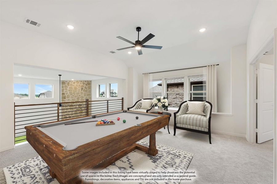 Game room with pool table, ceiling fan, open railing, and seating area on carpeted floor Game room with pool table, ceiling fan, open railing, and seating area on carpeted floor