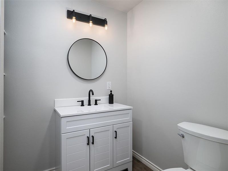 Bathroom featuring vanity and toilet