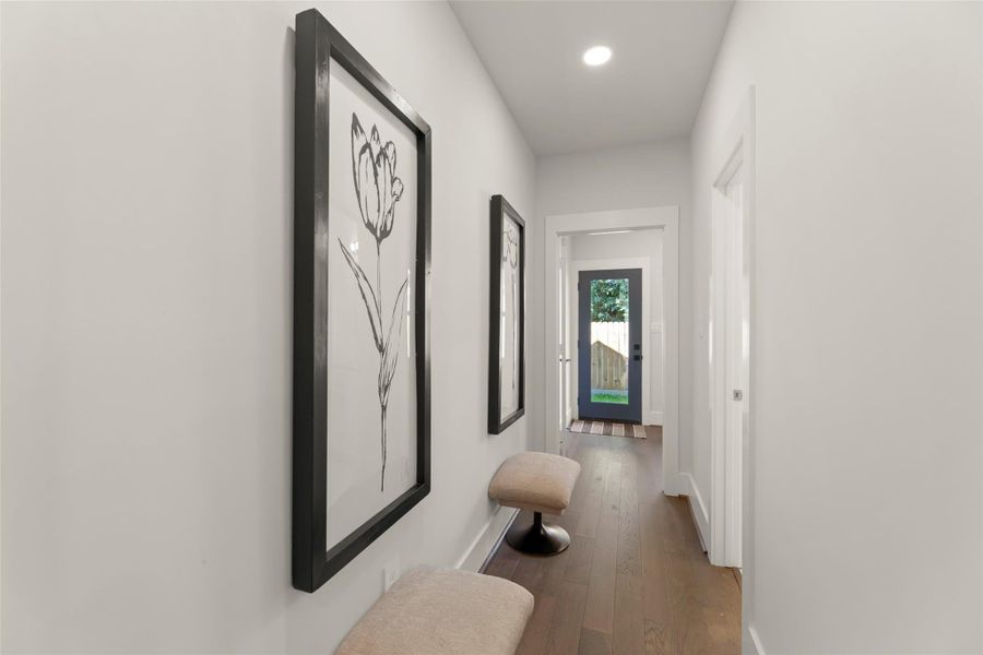 Hallway to powder room and utility room