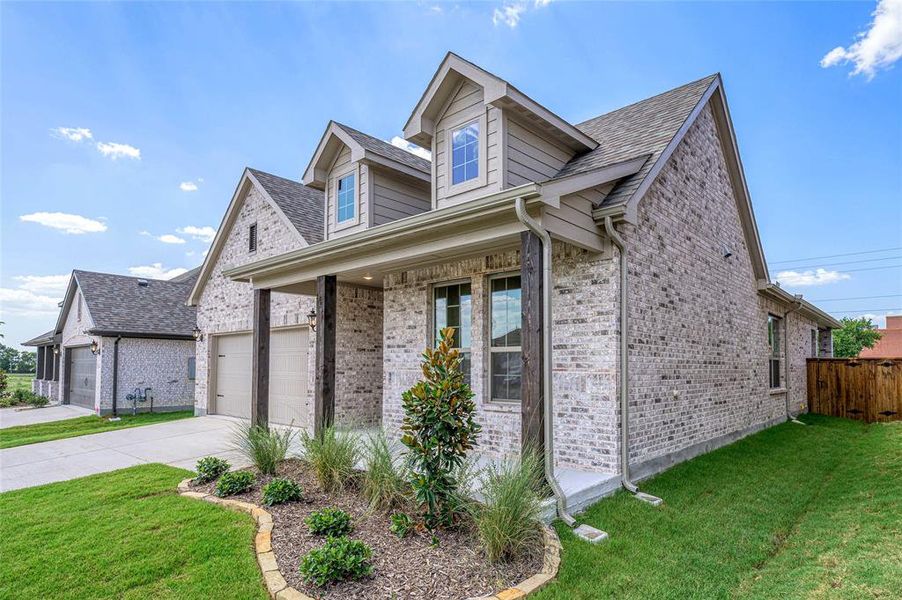 View of front of home featuring covered porch, brick siding, a garage, and concrete driveway View of front of home featuring covered porch, brick siding, a garage, and concrete driveway