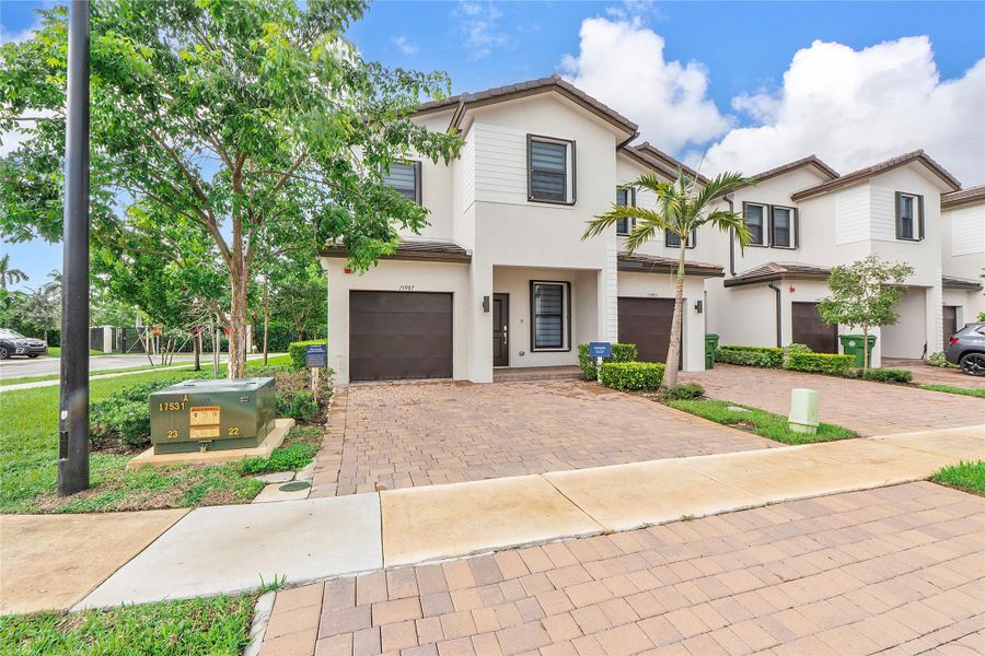 Front exterior of a new home in , Pembroke Pines, FL, highlighting curb appeal (Image 25).