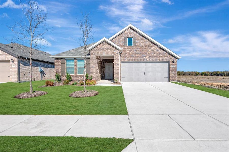 Front exterior of a new home in Verandah, Royse City, TX, highlighting curb appeal (Image 2).