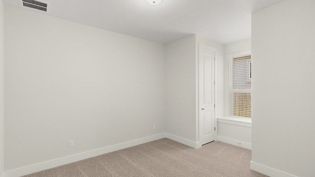 Representative unfurnished interior of a home built from the Brenner by Chesmar Homes in Newhaven, Manor (Image 32).