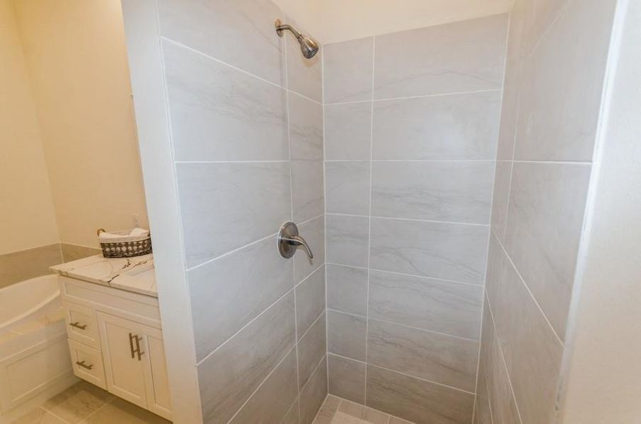 Bathroom with vanity, independent shower and bath, and tile patterned floors