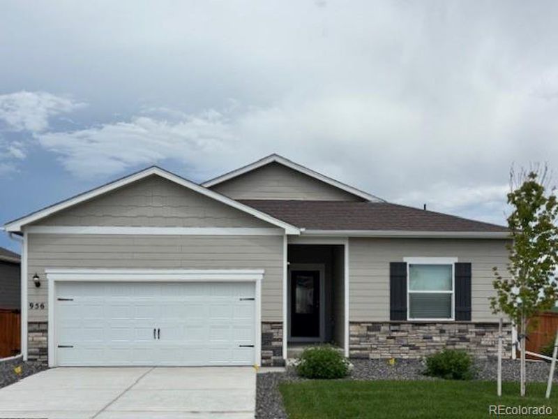 Front exterior of a new home in Hidden Valley Farm, Severance, CO, highlighting curb appeal (Image 16). Front exterior of a new home in Hidden Valley Farm, Severance, CO, highlighting curb appeal (Image 16).