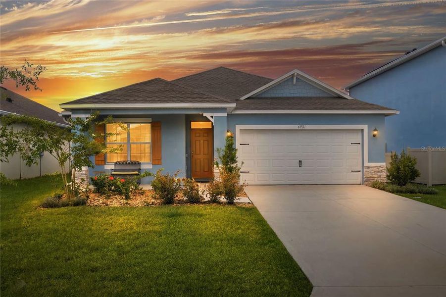 Front exterior of a new home in Summerlin at Hawthorne Ranch, Lakeland, FL, highlighting curb appeal (Image 2). Front exterior of a new home in Summerlin at Hawthorne Ranch, Lakeland, FL, highlighting curb appeal (Image 2).
