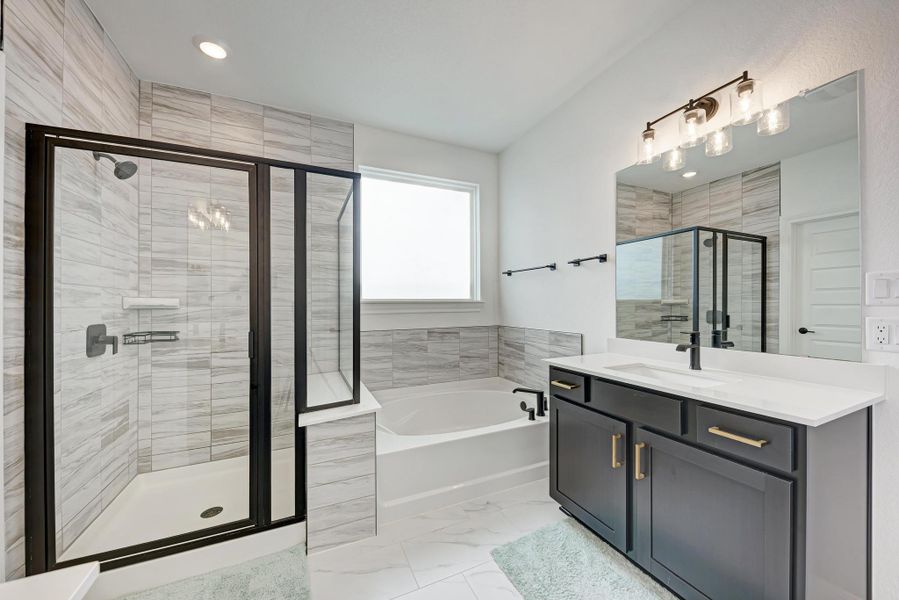 Full bath with a garden tub, vanity, a shower stall, light marble finish flooring, and recessed lighting