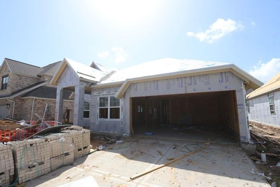 Front exterior of a new home in Meridiana 55' Homesites, Manvel, TX, highlighting curb appeal (Image 2).