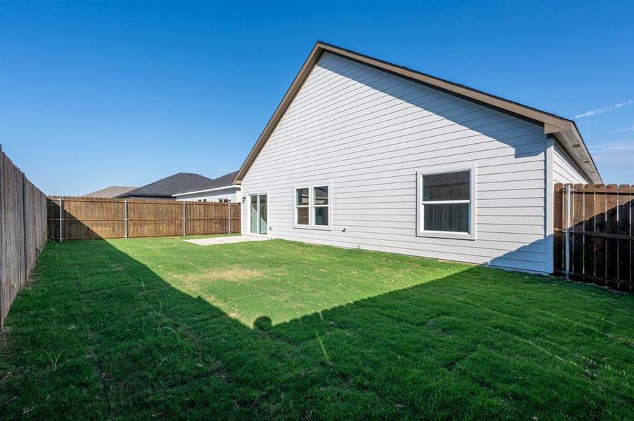 Exterior details and patio area of a home in Trails of Fossil Creek, Fort Worth (Image 16).
