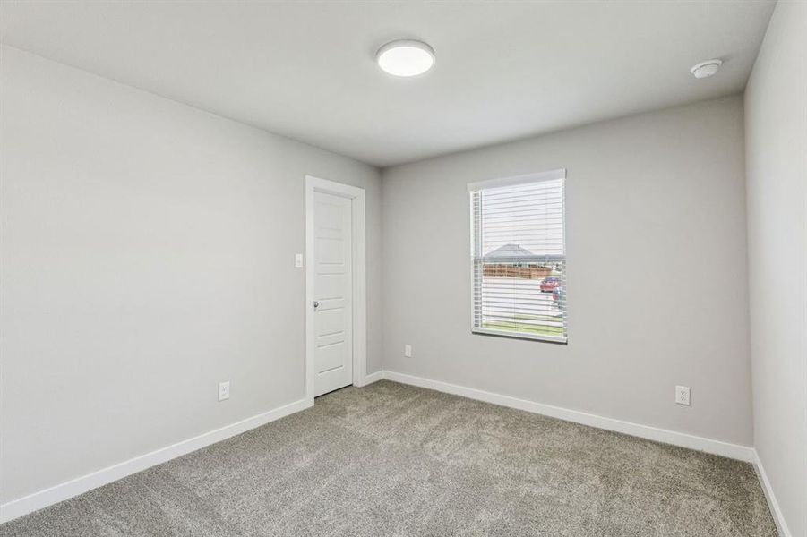 Bedroom in the Harper home plan by Trophy Signature Homes – REPRESENTATIVE PHOTO
