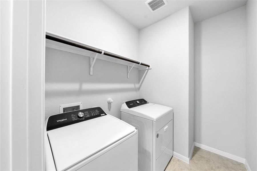 Laundry room with shelving