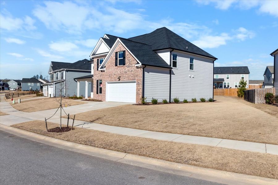 Front exterior of a new home in Tillery Park, Grovetown, GA, highlighting curb appeal (Image 26). Front exterior of a new home in Tillery Park, Grovetown, GA, highlighting curb appeal (Image 26).