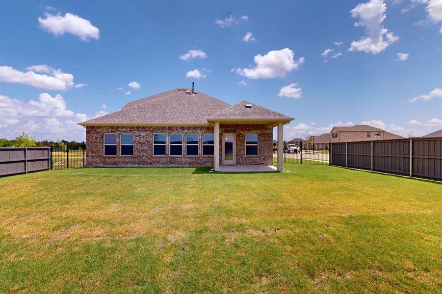 Exterior details and patio area of a home in Prairie Ridge at Goodland, Venus (Image 22). Exterior details and patio area of a home in Prairie Ridge at Goodland, Venus (Image 22).