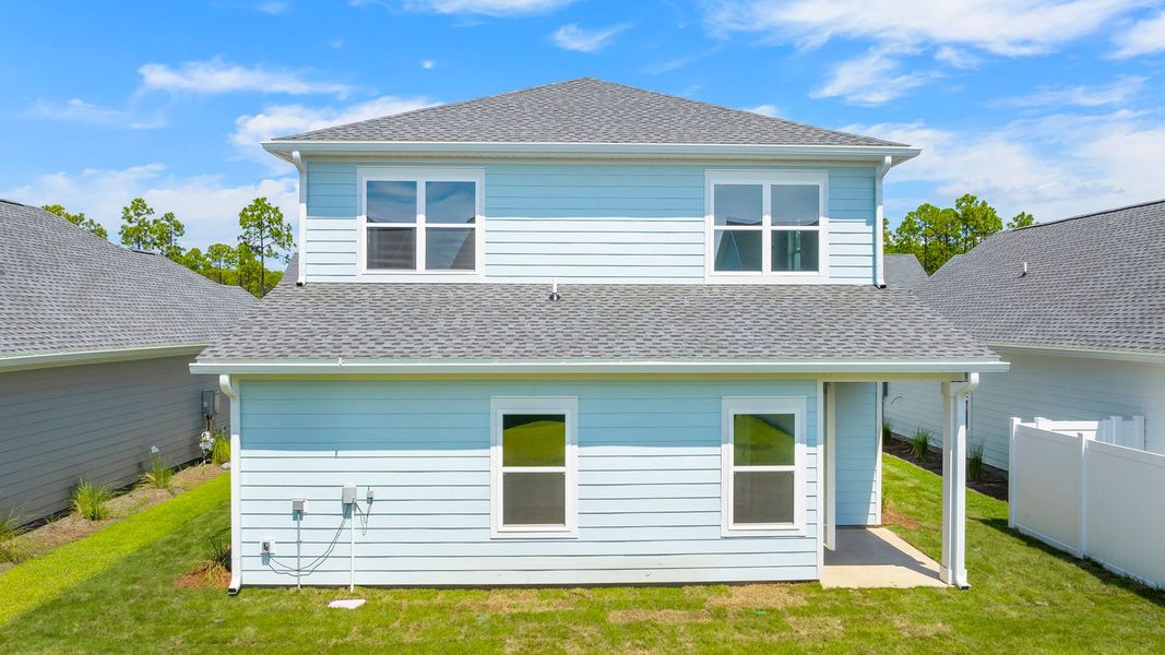 Front exterior of a new home in Breakfast Point East Phase I, Panama City Beach, FL, highlighting curb appeal (Image 20).