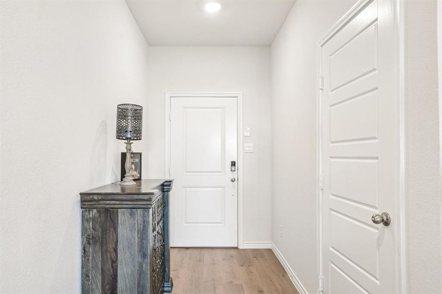 Entryway with wood finished floors and baseboards Entryway with wood finished floors and baseboards