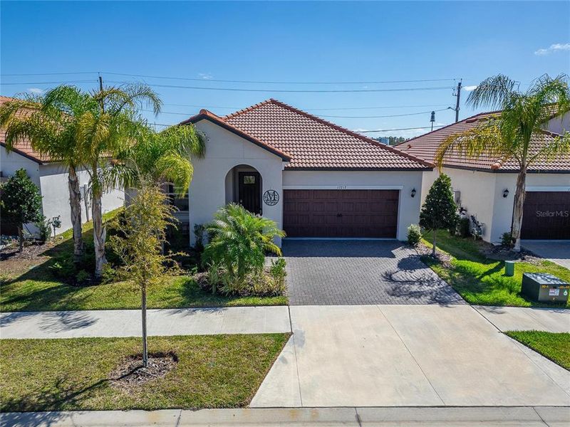 Front exterior of a new home in Southshore Bay Active Adult, Wimauma, FL, highlighting curb appeal (Image 23).