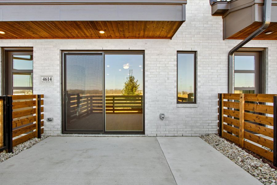 Exterior details and patio area of a home in Wildridge, Oak Point (Image 19).
