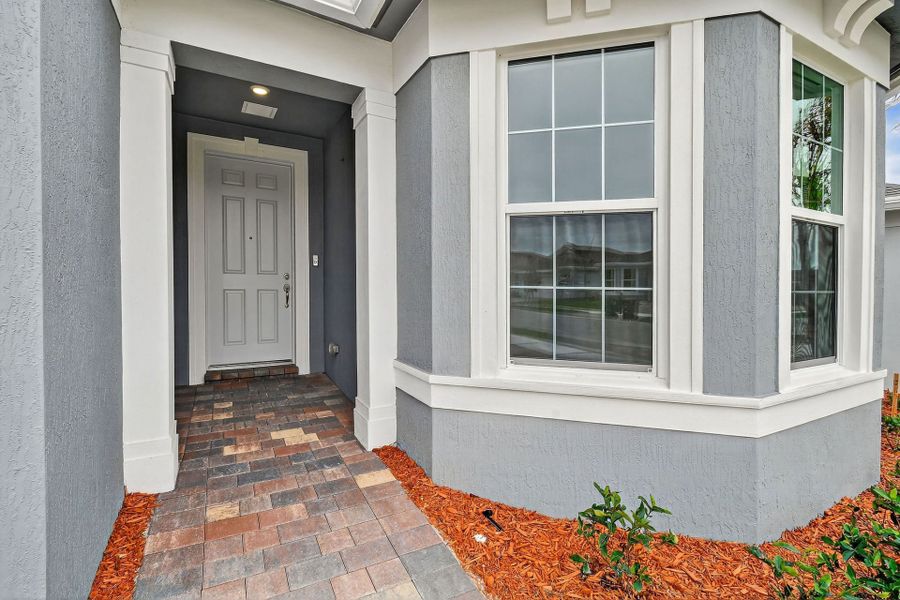 Exterior details and patio area of a home in Del Webb Tradition, Port St. Lucie (Image 4).