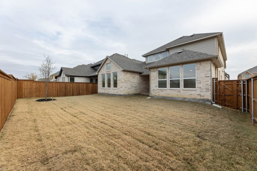 Exterior details and patio area of a home in Creekview Meadows, Pilot Point (Image 17).