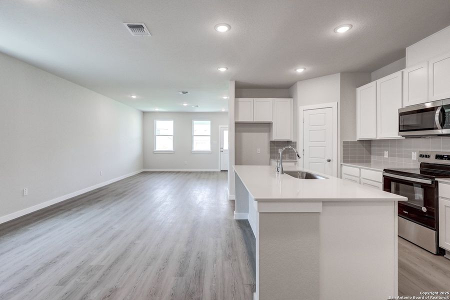 Furnished interior in a model home at Cinco Lakes in San Antonio (Image 19).
