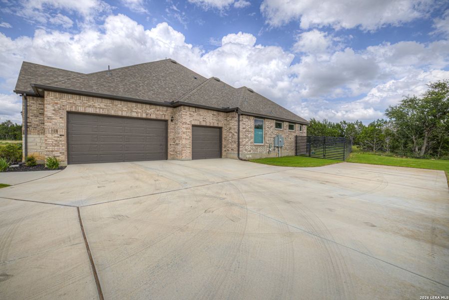 Front exterior of a new home in Waldsanger, New Braunfels, TX, highlighting curb appeal (Image 24).