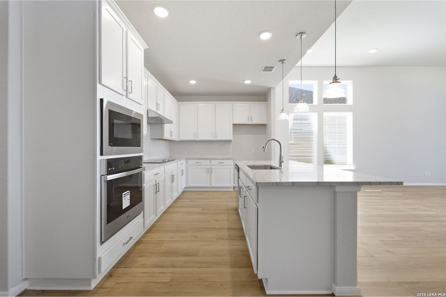 Furnished interior view inside a new home in The Woodlands at Medina Hills, Mico (Image 9).