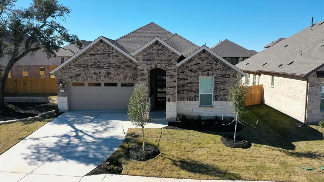 Front exterior of a new home in Rosenbusch Ranch, Leander, TX, highlighting curb appeal (Image 1). Front exterior of a new home in Rosenbusch Ranch, Leander, TX, highlighting curb appeal (Image 1).