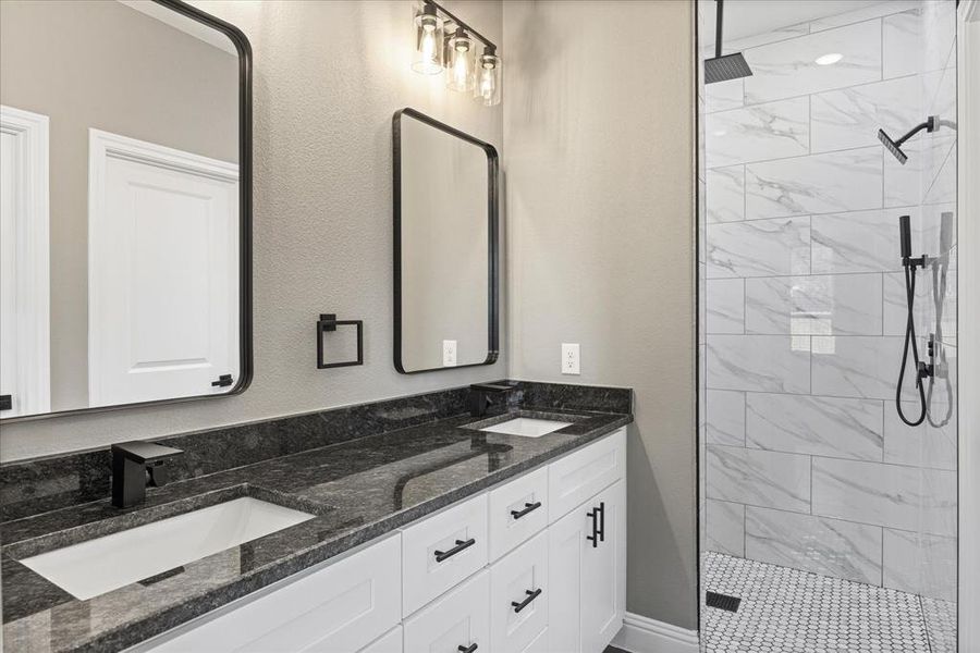 Bathroom with vanity and a gorgeous tile shower