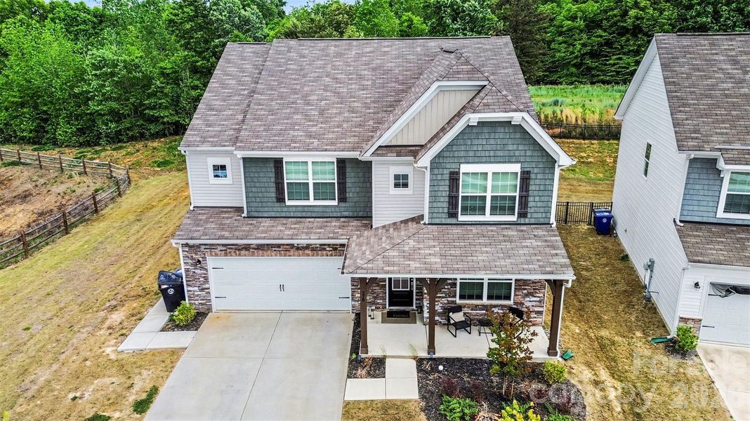 Front exterior of a new home in Gambill Forest: Enclave, Mooresville, NC, highlighting curb appeal (Image 22).
