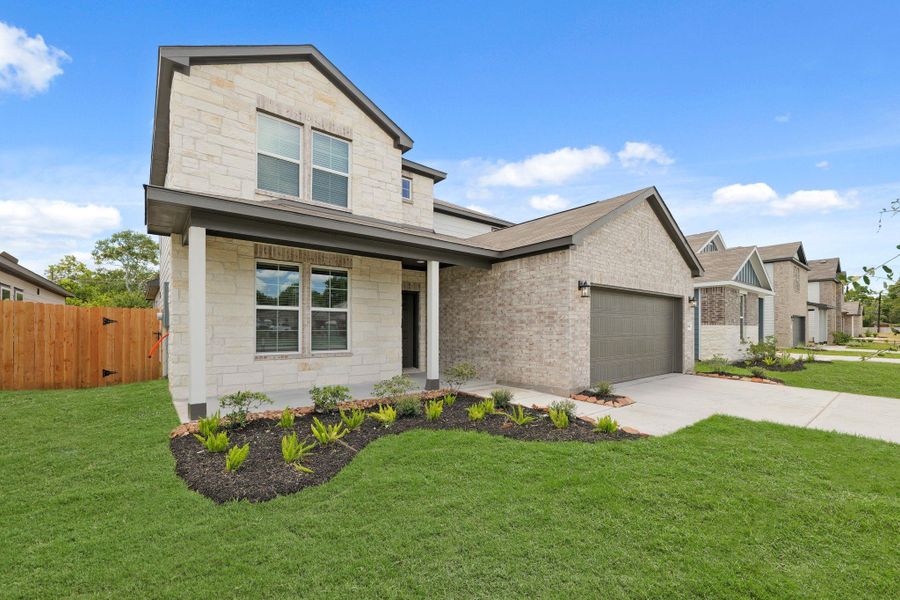Front exterior of a new home in Russell Ranch, Bay City, TX, highlighting curb appeal (Image 21).