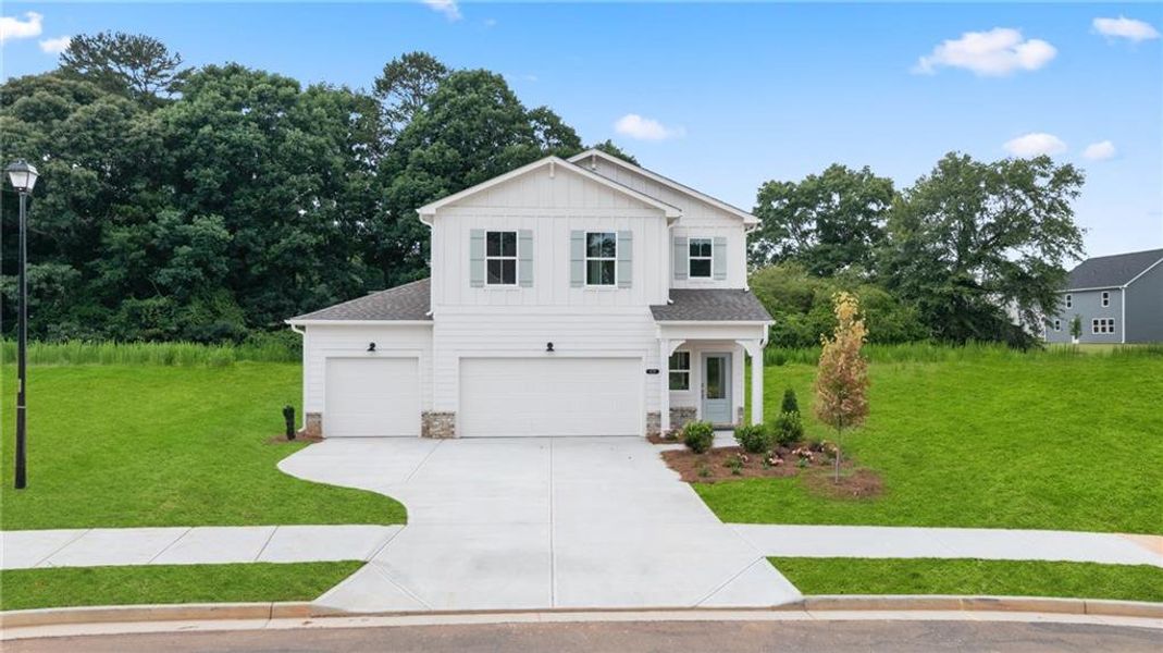 Front exterior of a new home in Cedar Farms, Winder, GA, highlighting curb appeal (Image 1). Front exterior of a new home in Cedar Farms, Winder, GA, highlighting curb appeal (Image 1).