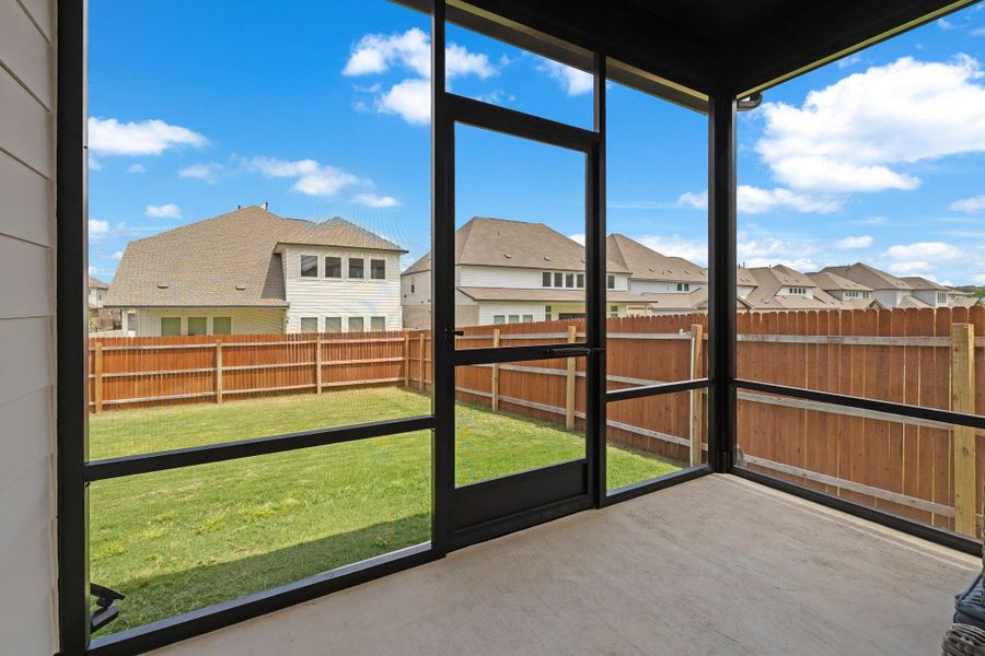 Custom screened in porch is perfect for lounging and enjoying the outdoors