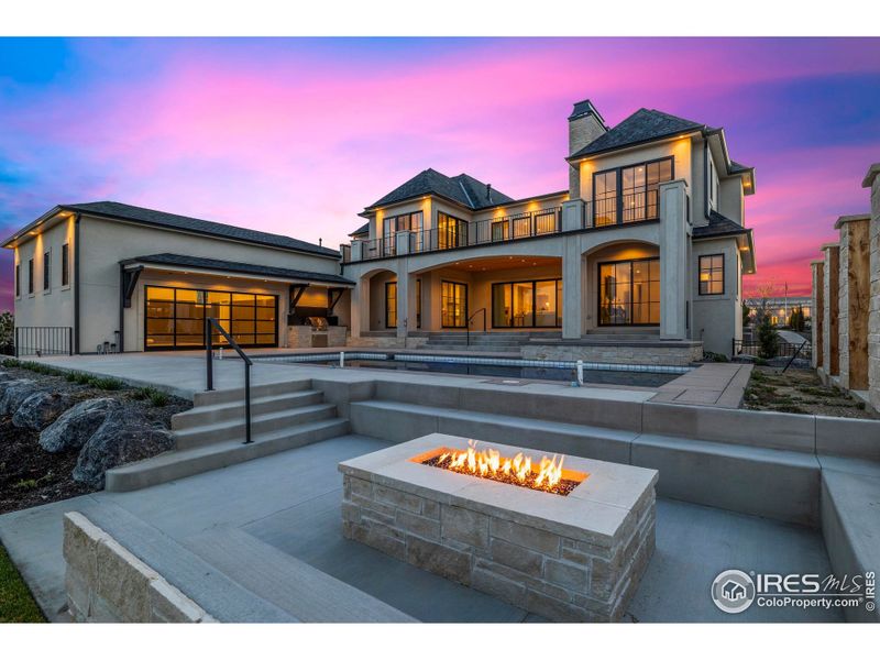 Poolside gas firepit and seating area