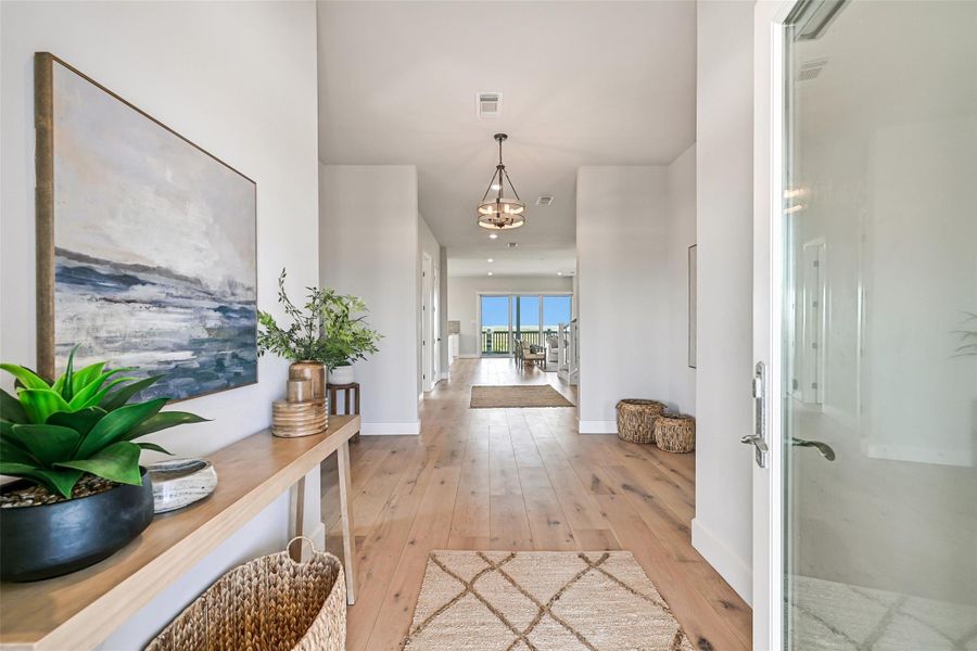 White oak flooring and open sightlines create an elegant welcome from the moment you step inside. The thoughtful layout flows effortlessly between entertaining areas and private retreats.