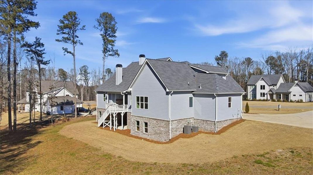 Front exterior of a new home in Old Town Estates, Monroe, GA, highlighting curb appeal (Image 31). Front exterior of a new home in Old Town Estates, Monroe, GA, highlighting curb appeal (Image 31).